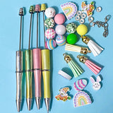 make a beaded pen pens black fineline ink gel ballpoint uk cute kawaii easter spring bunny rainbow egg gnome gnomes chunky bead beads wood wooden kit set gift gifts pink lemon yellow green lime soft pastel colour colours silver set tassel hanging build a