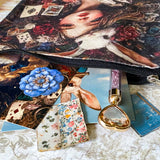 letterbox gift set with alice in wonderland vintage pouch, postcards, stickers and crystal ballpoint heart pen