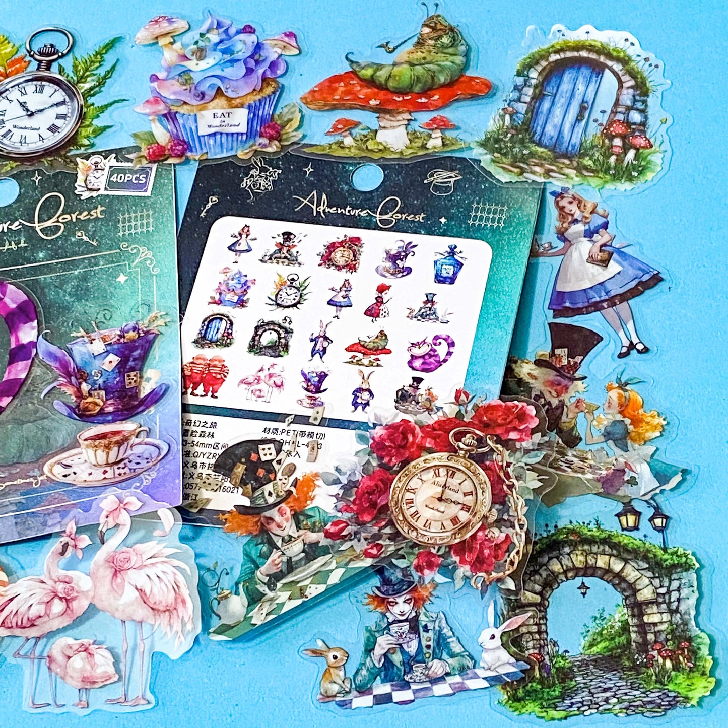 vibrant clear plastic PET stickers with an Alice in wonderland theme including illustrations of flamingo eat me cake, drink me potion, white rabbit, caterpillar on mushroom and pocket watch