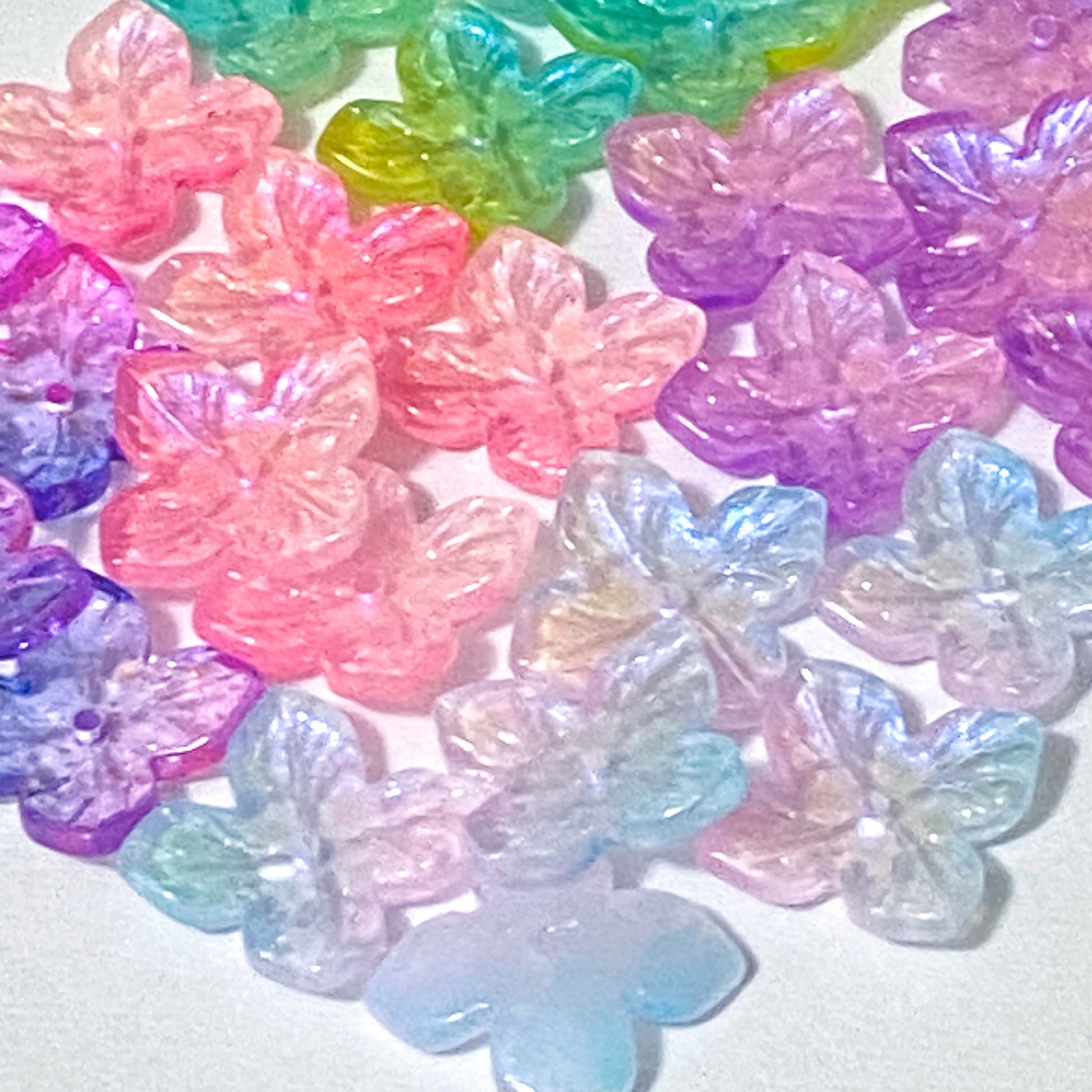 iridescent ab coated glass 4 petal petalled flower flowers bead beads uk cute kawaii colourful craft supples shop store pink lilac purple turquoise green blue shimmer 18mm jewellery making 