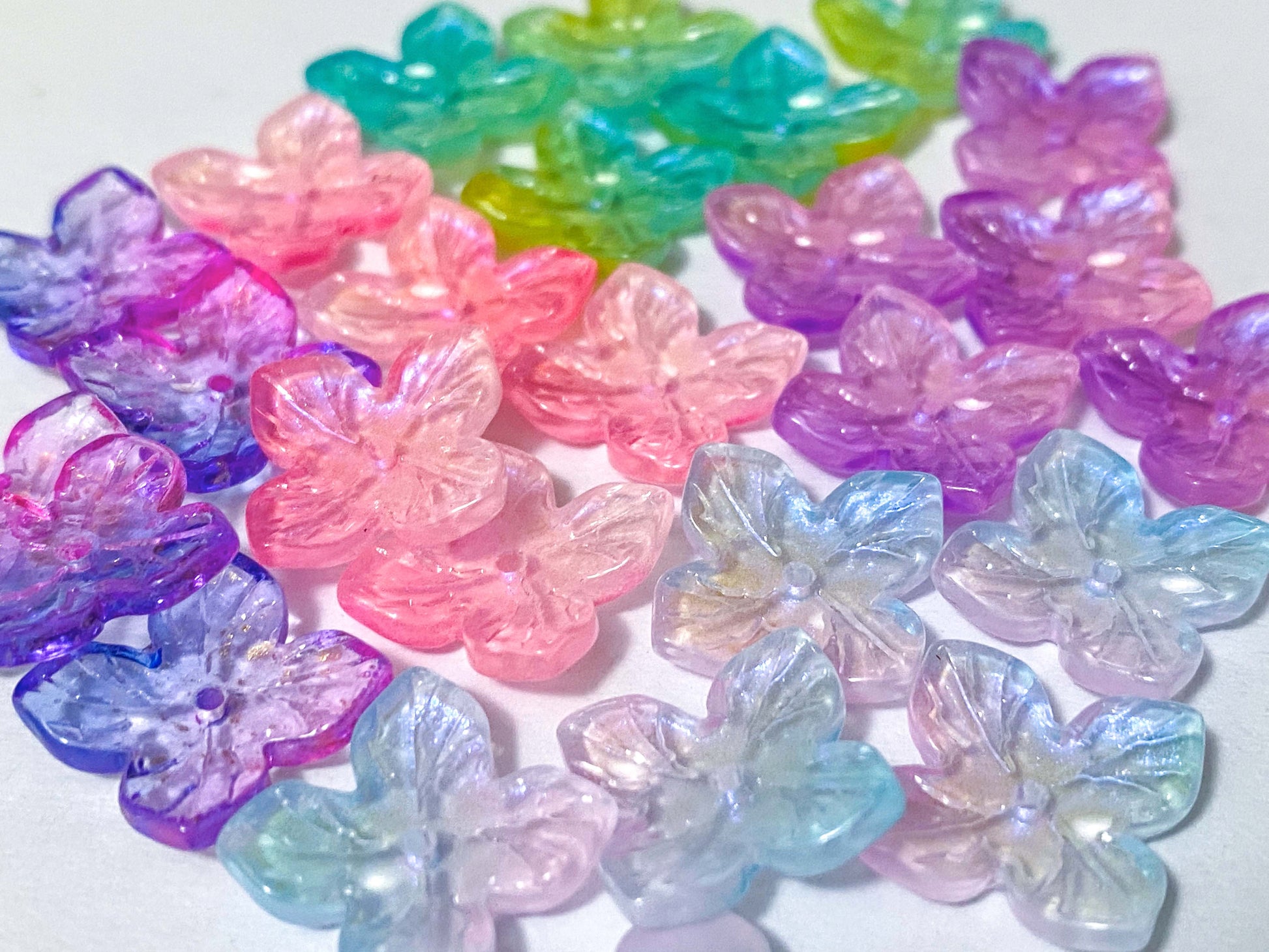 iridescent ab coated glass 4 petal petalled flower flowers bead beads uk cute kawaii colourful craft supples shop store pink lilac purple turquoise green blue shimmer 18mm jewellery making 