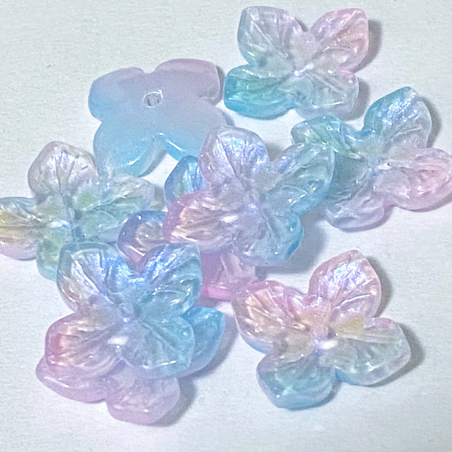 iridescent ab coated glass 4 petal petalled flower flowers bead beads uk cute kawaii colourful craft supples shop store pink lilac purple turquoise green blue shimmer 18mm jewellery making 