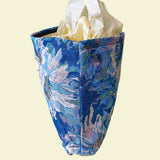 blue, pale pink and turquoise chrysanthemum tapestry pouch with woven floral fabric, cream lining, concealed zip closure and gusseted base. Botanical make up cosmetic pouch, large pencil case or journaling bag. Uk gifts shop. Gifts for flower lovers.
