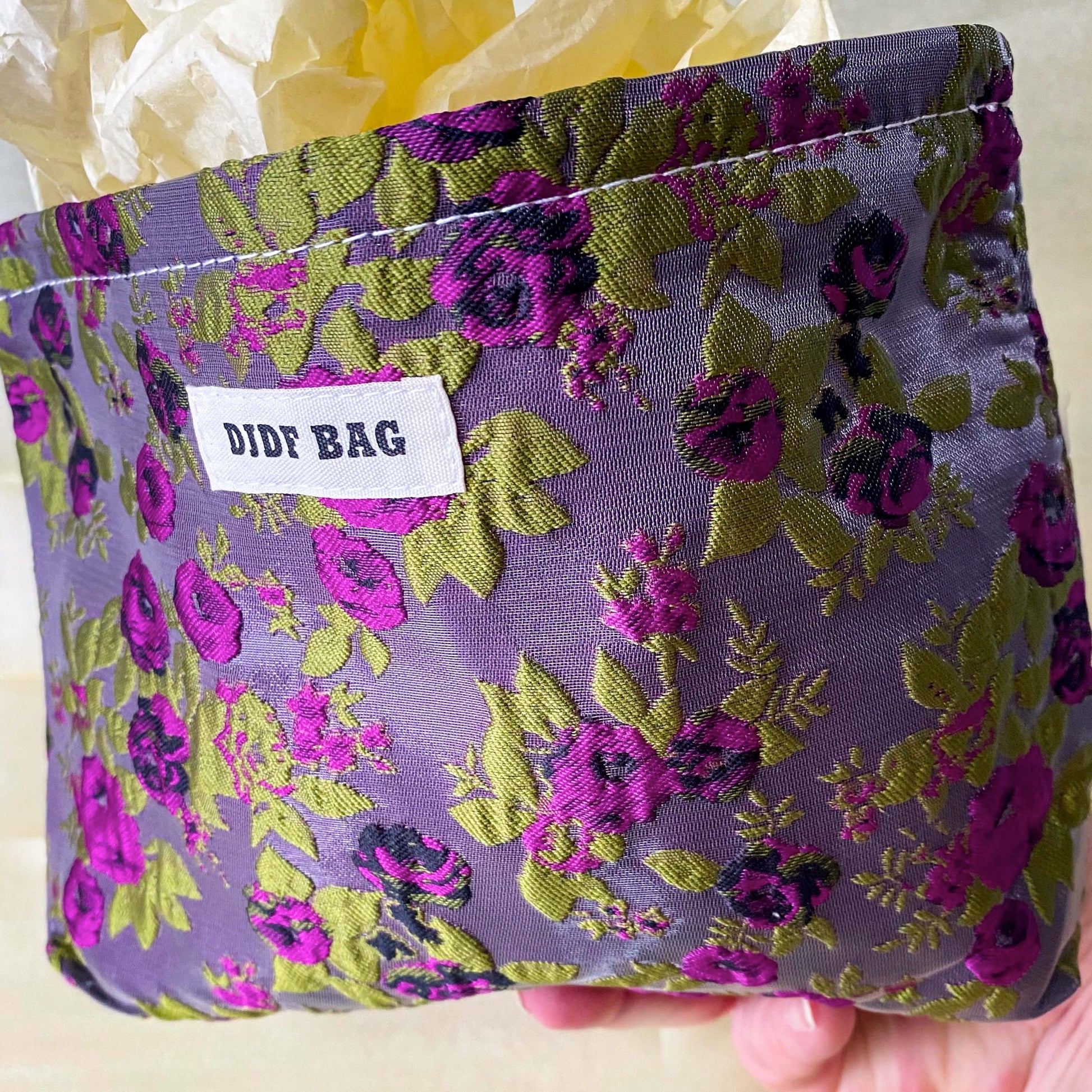 purple and green tapestry cometic pouch with woven satin-finish fabric with roses design, concealed zip, cream lining and gusseted base. Victorian inspired floral gift ideas from uk shop. museum quality cosmetic bag.