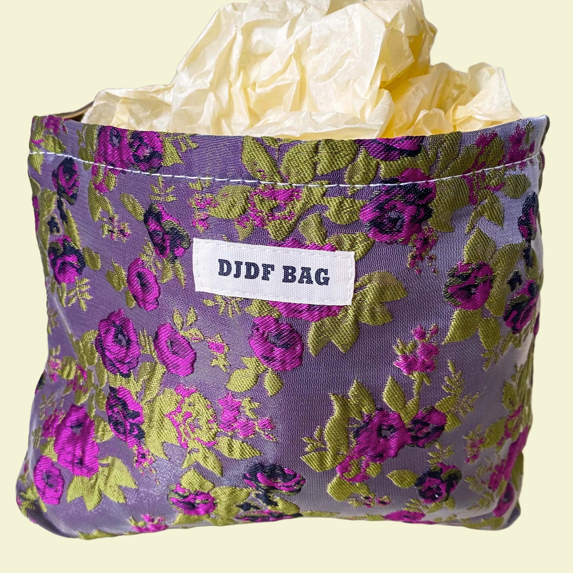 purple and green tapestry cometic pouch with woven satin-finish fabric with roses design, concealed zip, cream lining and gusseted base. Victorian inspired floral gift ideas from uk shop. museum quality cosmetic bag.