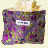 purple and green tapestry cometic pouch with woven satin-finish fabric with roses design, concealed zip, cream lining and gusseted base. Victorian inspired floral gift ideas from uk shop. museum quality cosmetic bag.