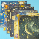 celestial scrapbook paper pack with dark blue sky night designs featuring gold stars, moons, planets and vintage astrology illustrations
