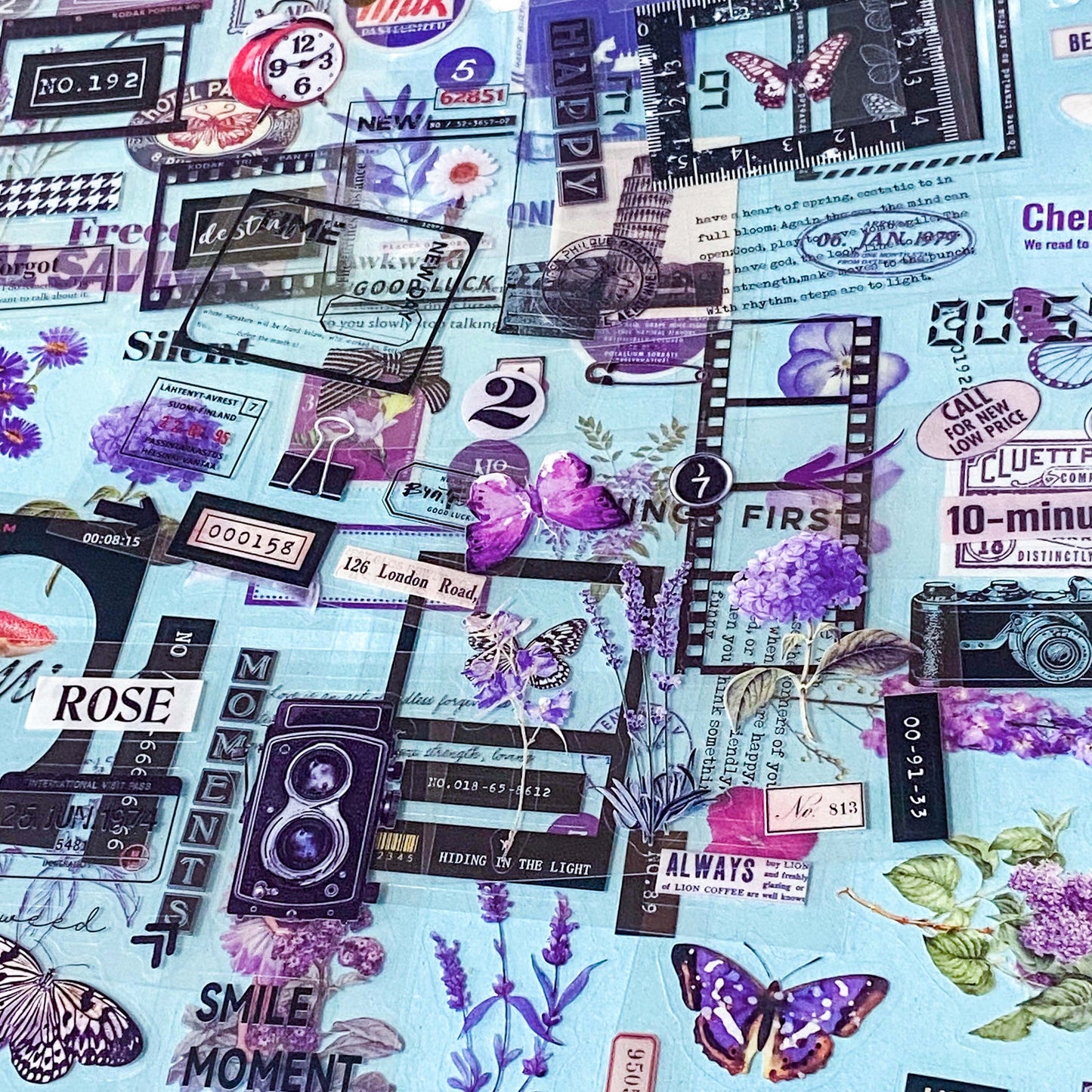 pack of 25 clear sticker sheets featuring purple vintage collage elements including butterflies, flowers, labels and decorative frames