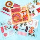 collection of 25 sheets of clear stickers featuring vintage botanical illustrations, flowers, butterflies, labels, borders and tickets with a pink and red theme