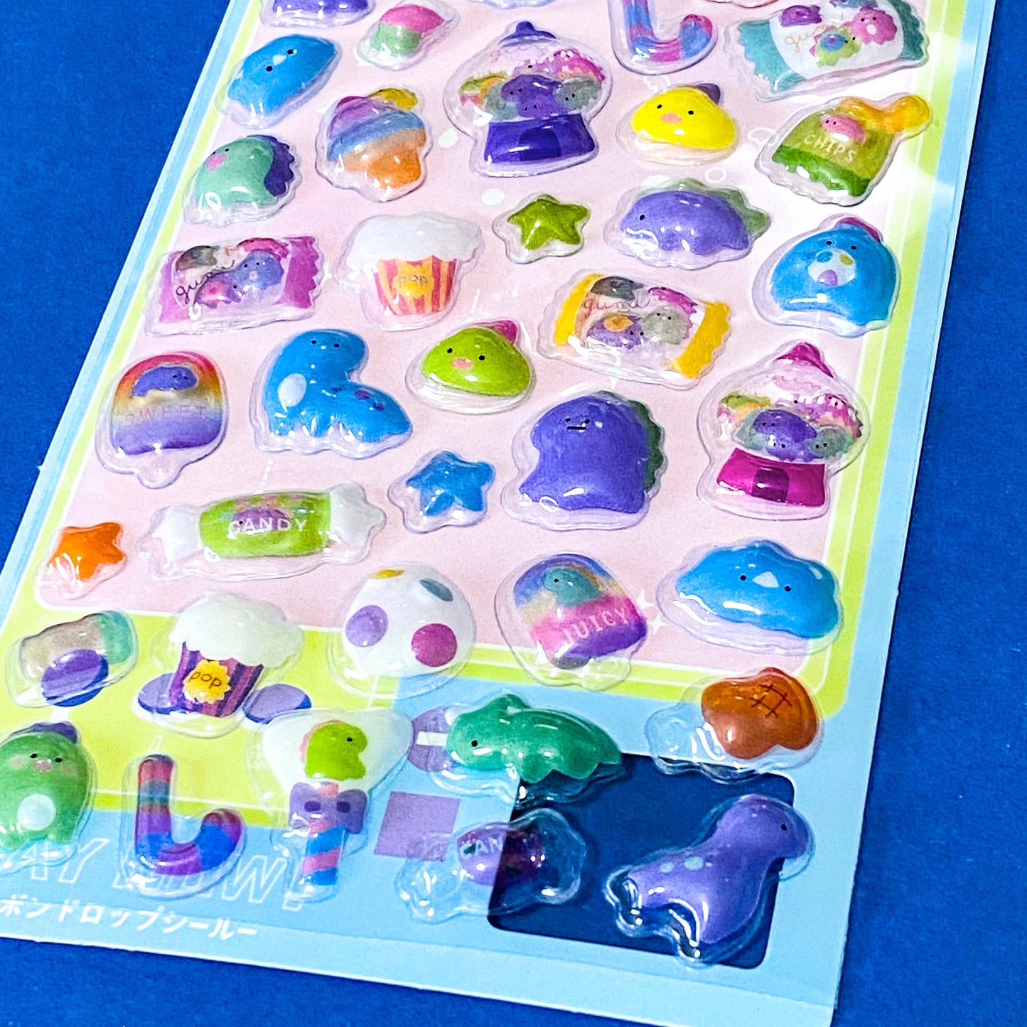 close up of kawaii 3d domed stickers with glossy raised plastic finish