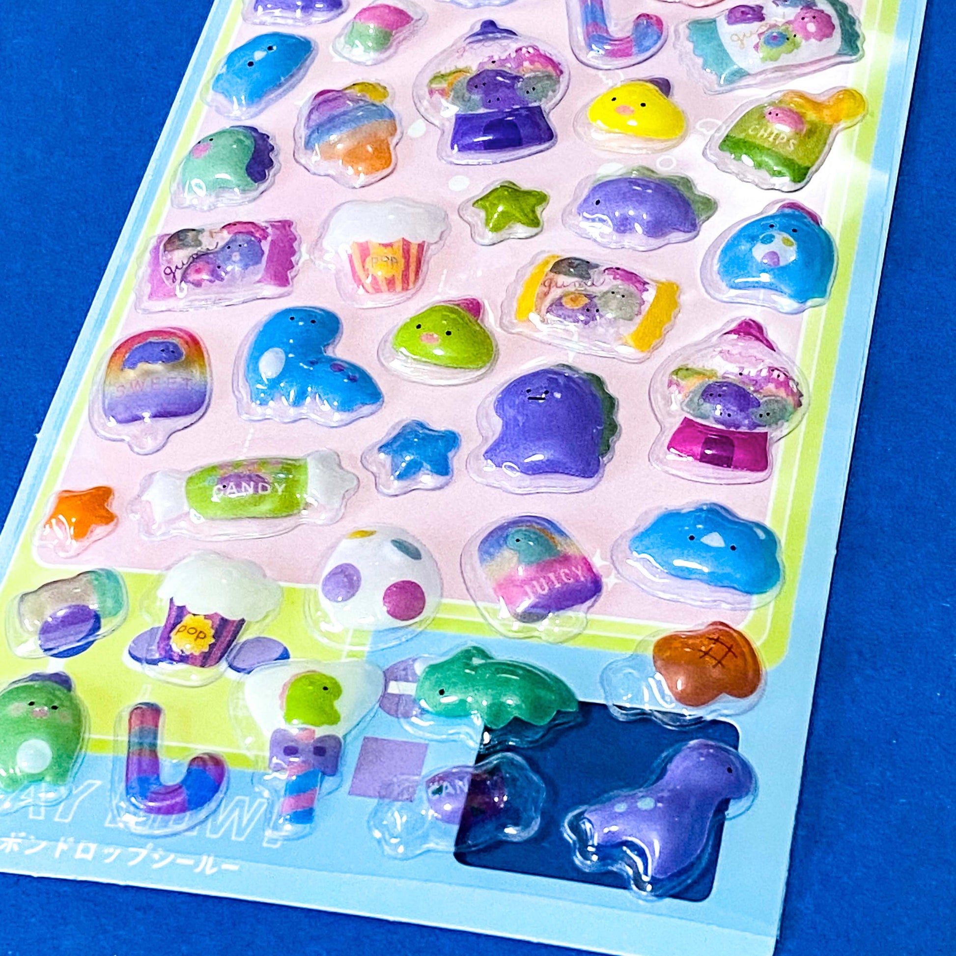 close up of kawaii 3d domed stickers with glossy raised plastic finish