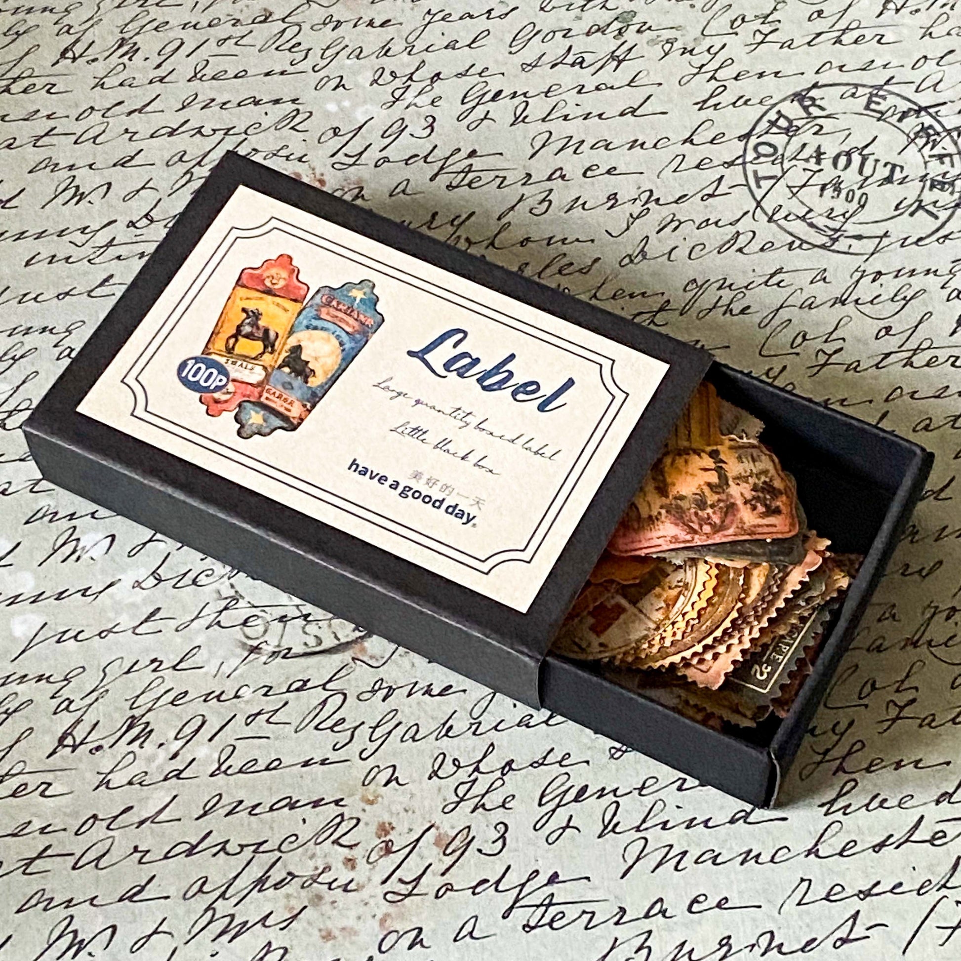 mini box of 100 vintage labels and tags with antique matte finish on a handwritten background