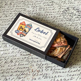 mini box of 100 vintage labels and tags with antique matte finish on a handwritten background