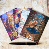 fanned alice in wonderland postcards showing pastel flamingo, mirror and storybook garden scenes with a fountain pen