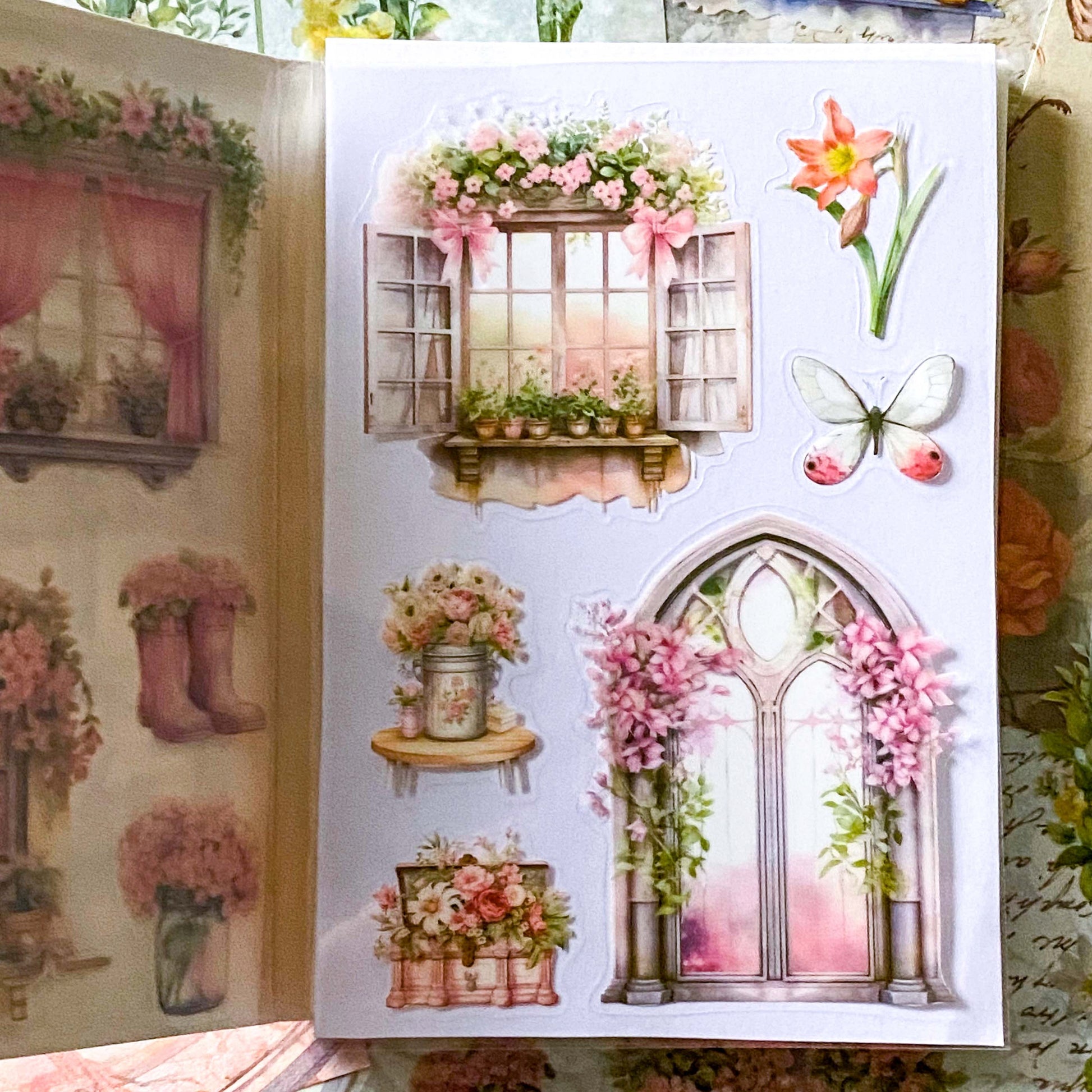 close up of pink and cream floral stickers and window illustrations with a butterfly