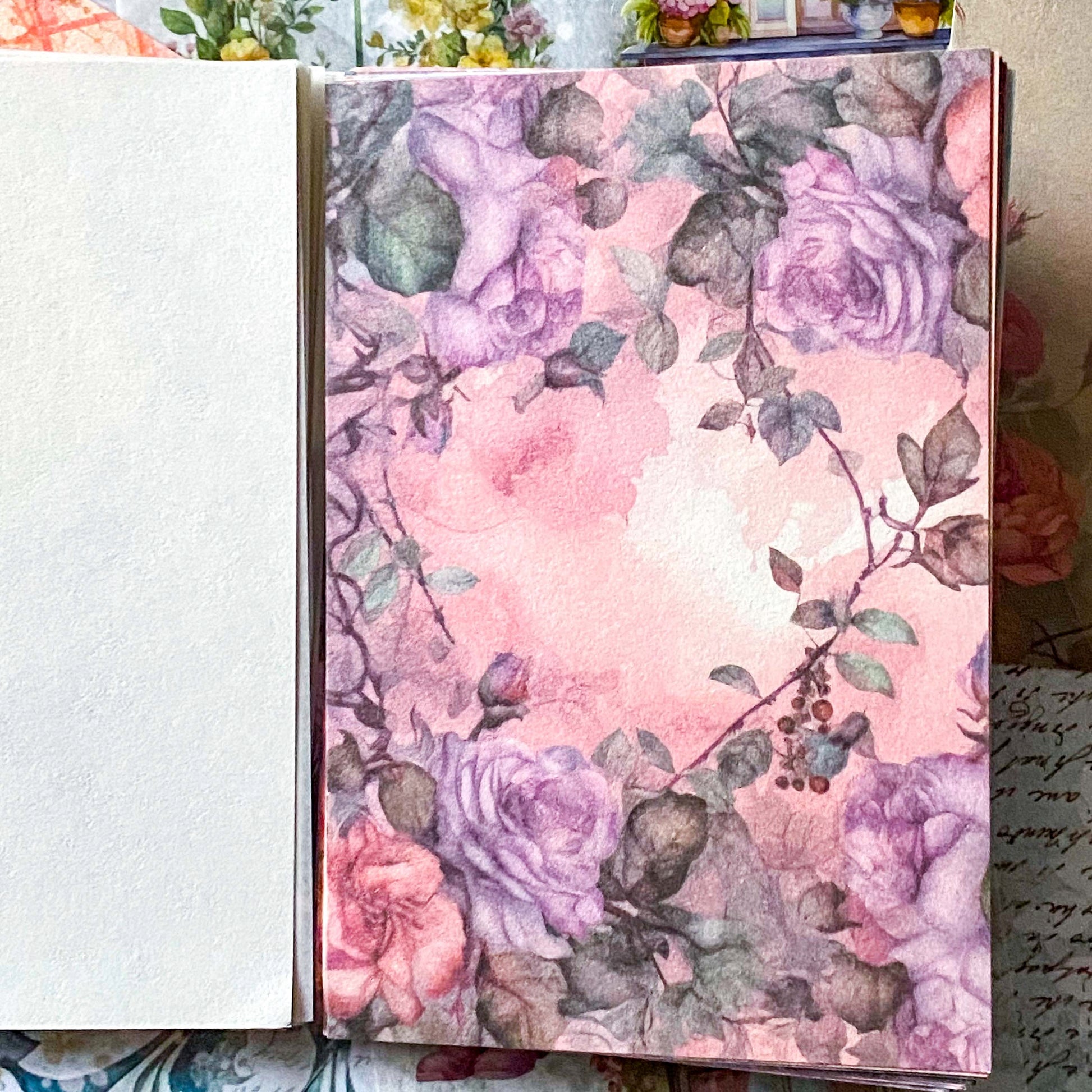 sheet of floral scrapbook paper with vintage rose pattern design for collage and journaling