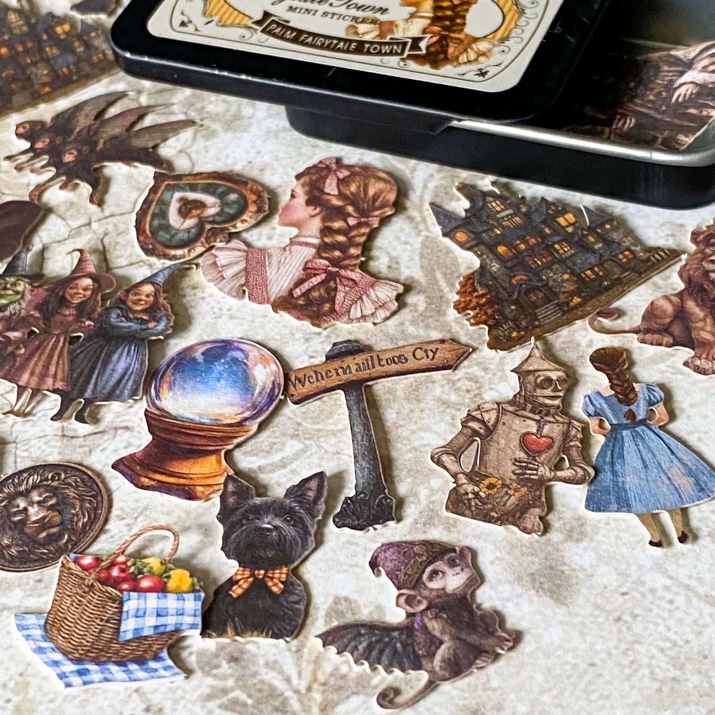 wizard of Oz card stickers in a mini tin featuring vintage style illustrations of dorothy, the lion, tin man and witch