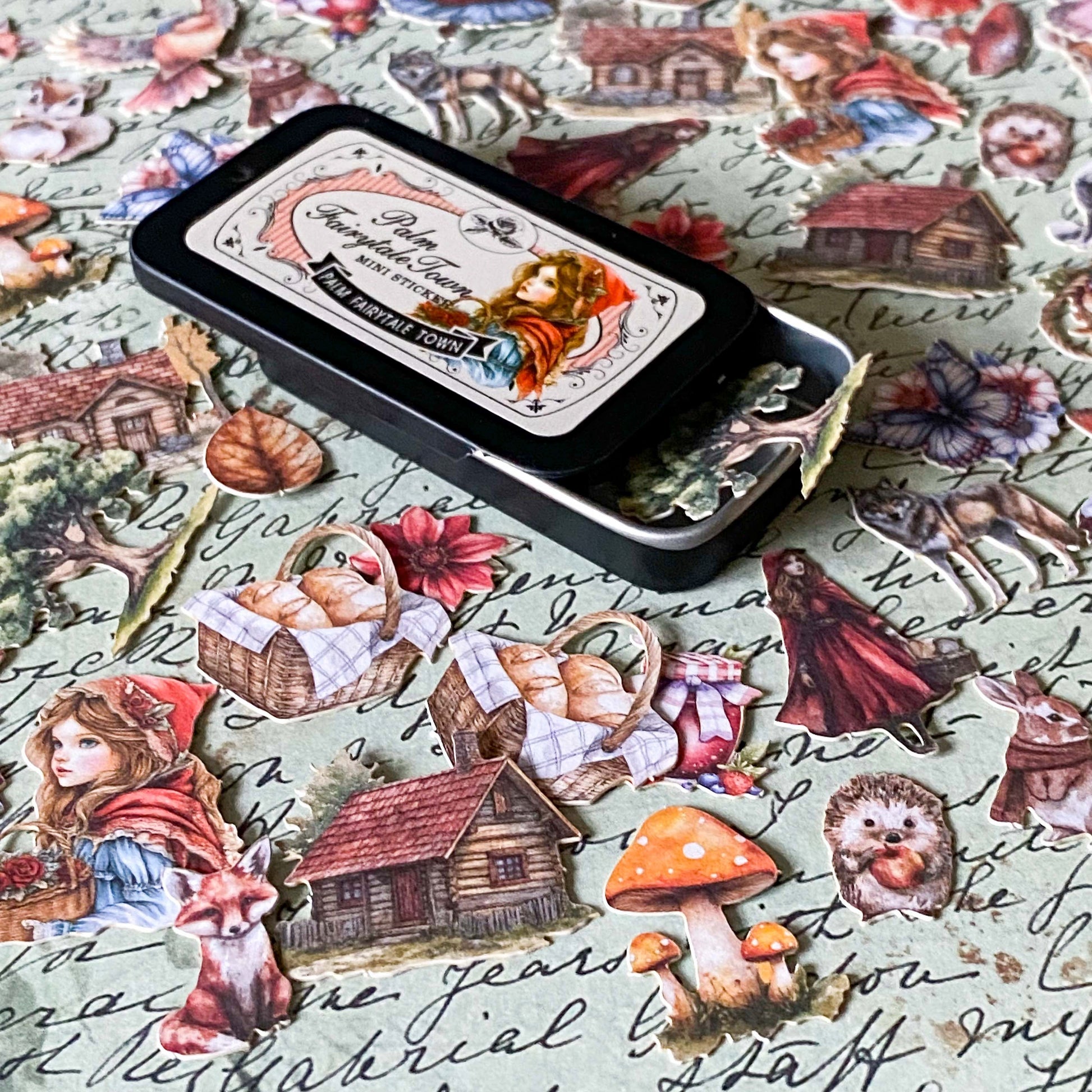 red riding hood tin of 60 small card stickers with illustrations of wolf, girl, mushrooms, cottage and forest animals