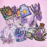 magic magical spooky sticker stickers flake flakes pack of 30 very large big holo holographic foil clear plastic pet black cat cats gems crystal crystals moon candle book potion bottle hat witch witches witchcraft uk cute kawaii stationery shop store purple lilac blue yellow vibrant sparkly glitter