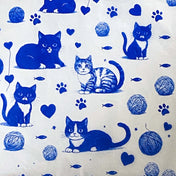tissue paper with a Pattern of blue cats, hearts, paw prints, and yarn balls on a white background