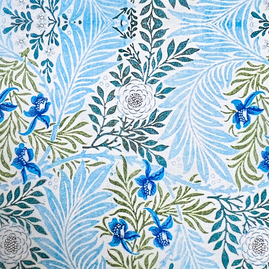  tissue paper with a with blue and green floral and leaf designs on a white background