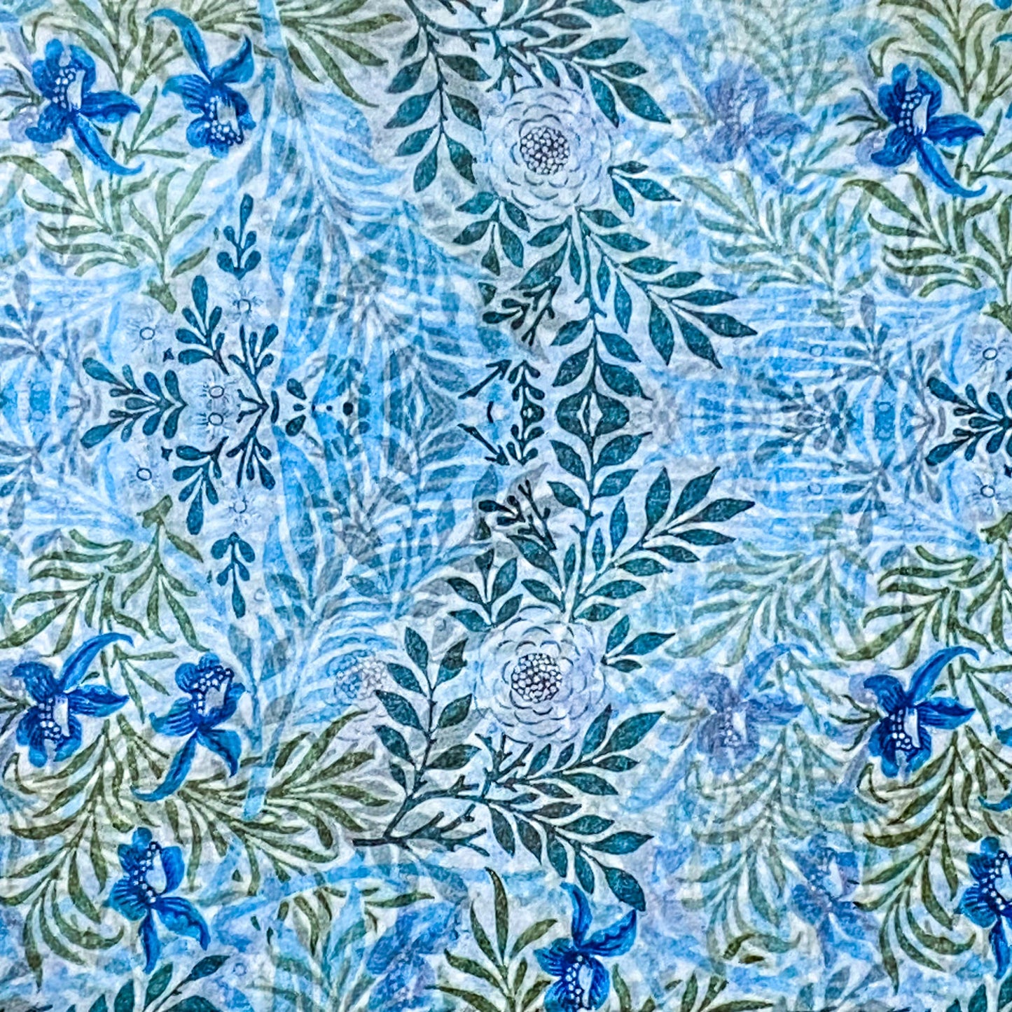 Blue and green floral patterned tissue paper sheets
