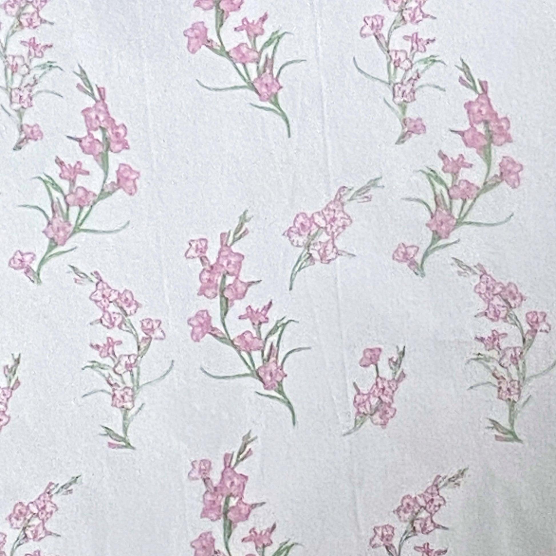 Floral pattern tissue paper with pink flowers and green leaves on a white background