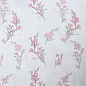 Floral pattern tissue paper with pink flowers and green leaves on a white background