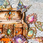 aesthetic scrapbook stickers with jewels and butterfly designs in a treasure box