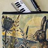vintage moonrise hare moonlit cosmetic bag or make up pouch with muted colours and botanical illustration of grasses, hares and night sky. uk letterbox gifts shop.