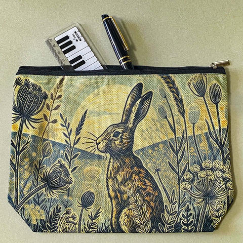 vintage moonrise hare moonlit cosmetic bag or make up pouch with muted colours and botanical illustration of grasses, hares and night sky. uk letterbox gifts shop.