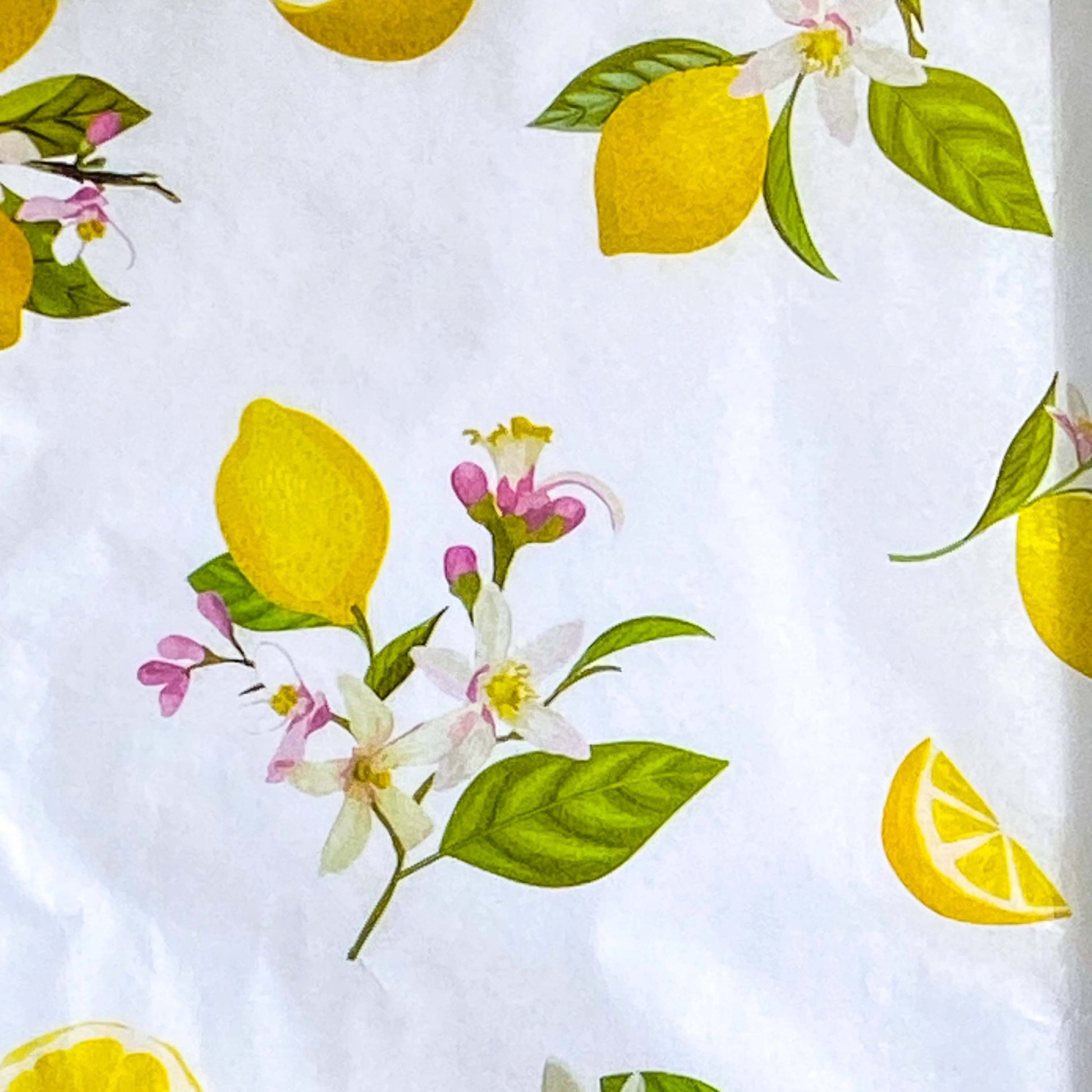 pack of 3 sheets white tissue paper with yellow lemons and pale pink blossoms with green leaves. citrus grove pattern. uk packaging supplies.