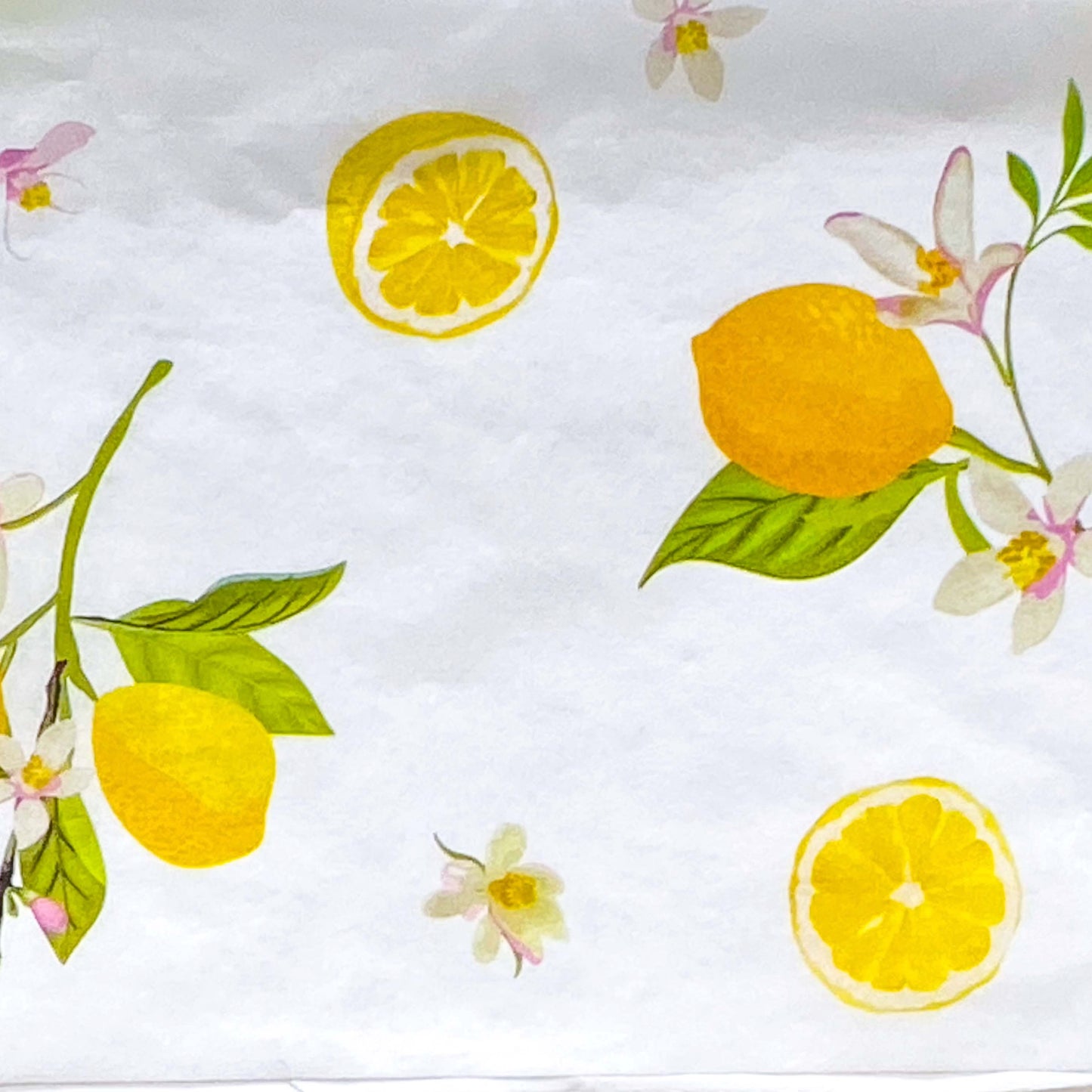 pack of 3 sheets white tissue paper with yellow lemons and pale pink blossoms with green leaves. citrus grove pattern. uk packaging supplies.
