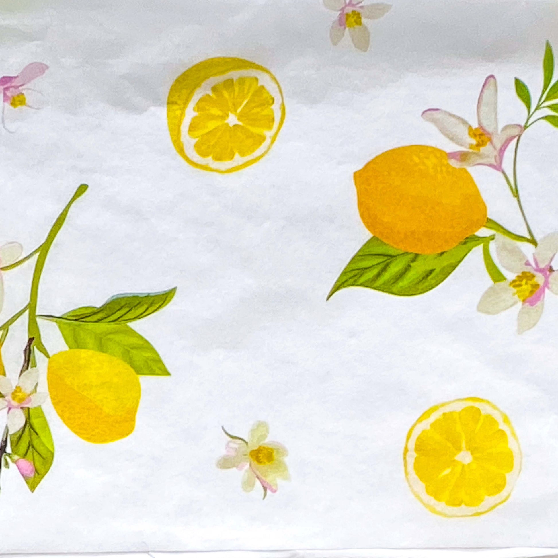 pack of 3 sheets white tissue paper with yellow lemons and pale pink blossoms with green leaves. citrus grove pattern. uk packaging supplies.