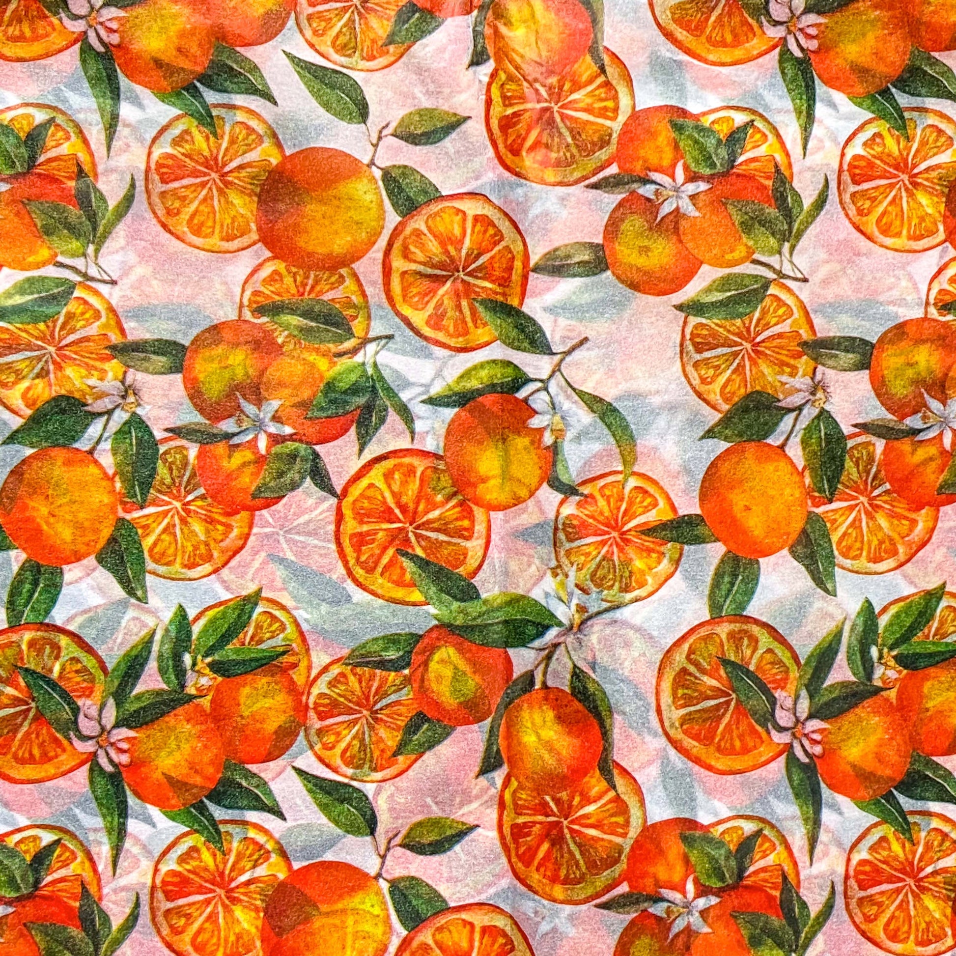 bright juicy orange fruits on white tissue paper sheets. Pack of 3 sheet in vibrant oranges and greens for summertime gifting. Uk packaging supplies. 