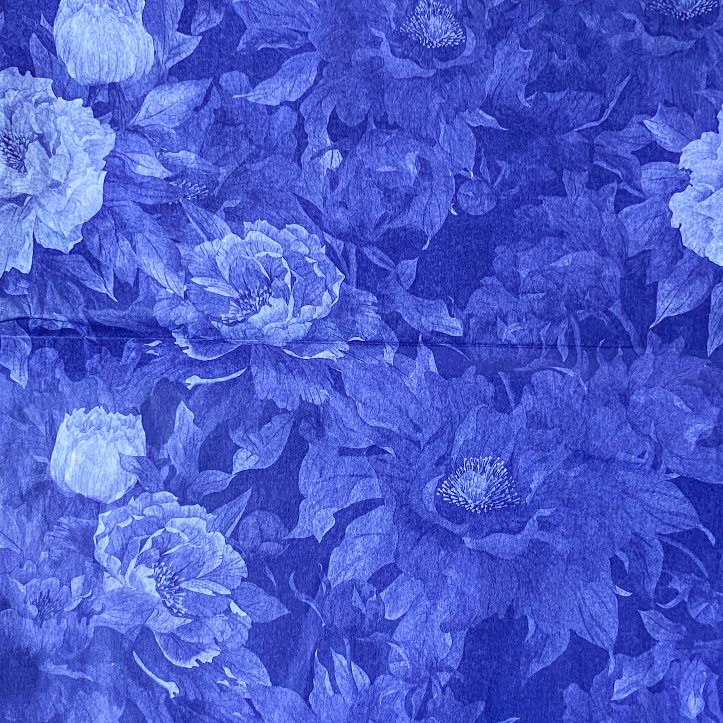 deep inky purple dark blue indigo floral pattern tissue paper with large poppies at midnight. Beautiful packaging papers from the Uk.