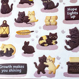 pack of dark grey and caramel coloured cat stickers with household objects and cookie shapes. Fun kawaii stationery pack of 2 transparent PET sheets.
