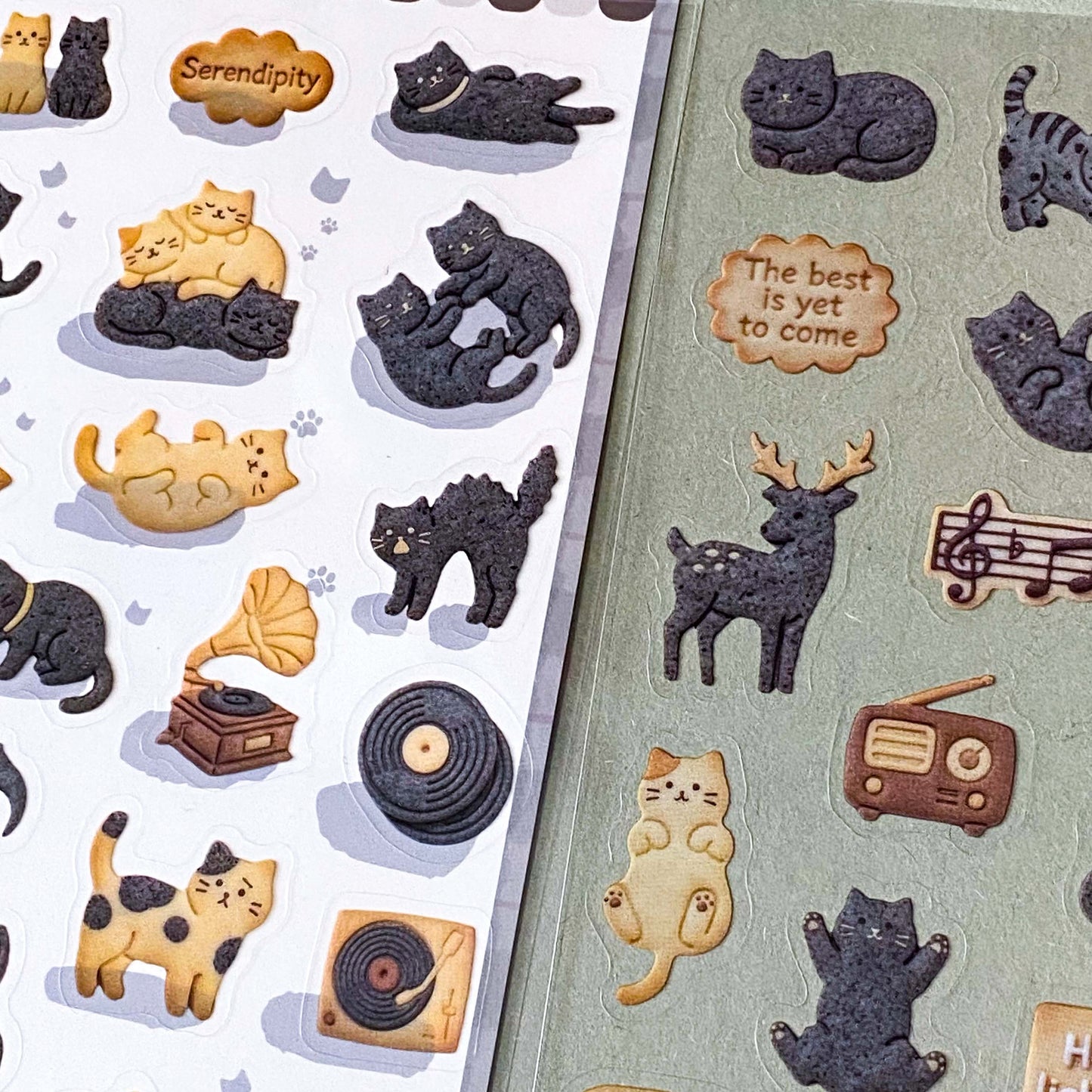 pack of dark grey and caramel coloured cat stickers with household objects and cookie shapes. Fun kawaii stationery pack of 2 transparent PET sheets.