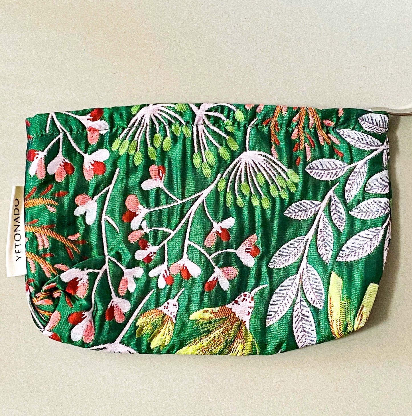 emerald green conservatory pattern woven tapestry premium make up pouch, small cosmetic bag with concealed zip and full fabric lining. rich jewel colours with flowers and leaves. uk letterbox gift