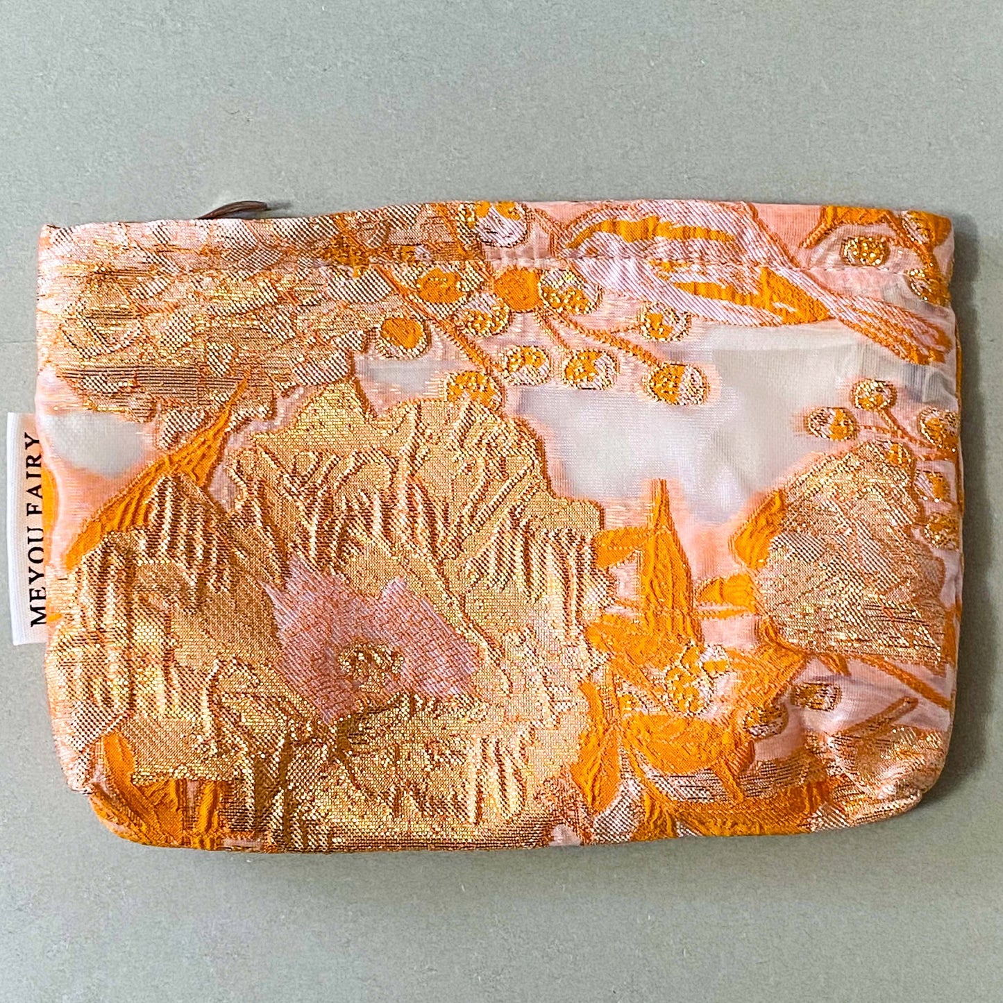 peaches and cream warm orange and gold metallic thread woven tapestry pouch for make up and beauty essentials. fully lined in cream with a concealed zip. floral pattern small fabric cosmetic bag. uk letterbox gifts.