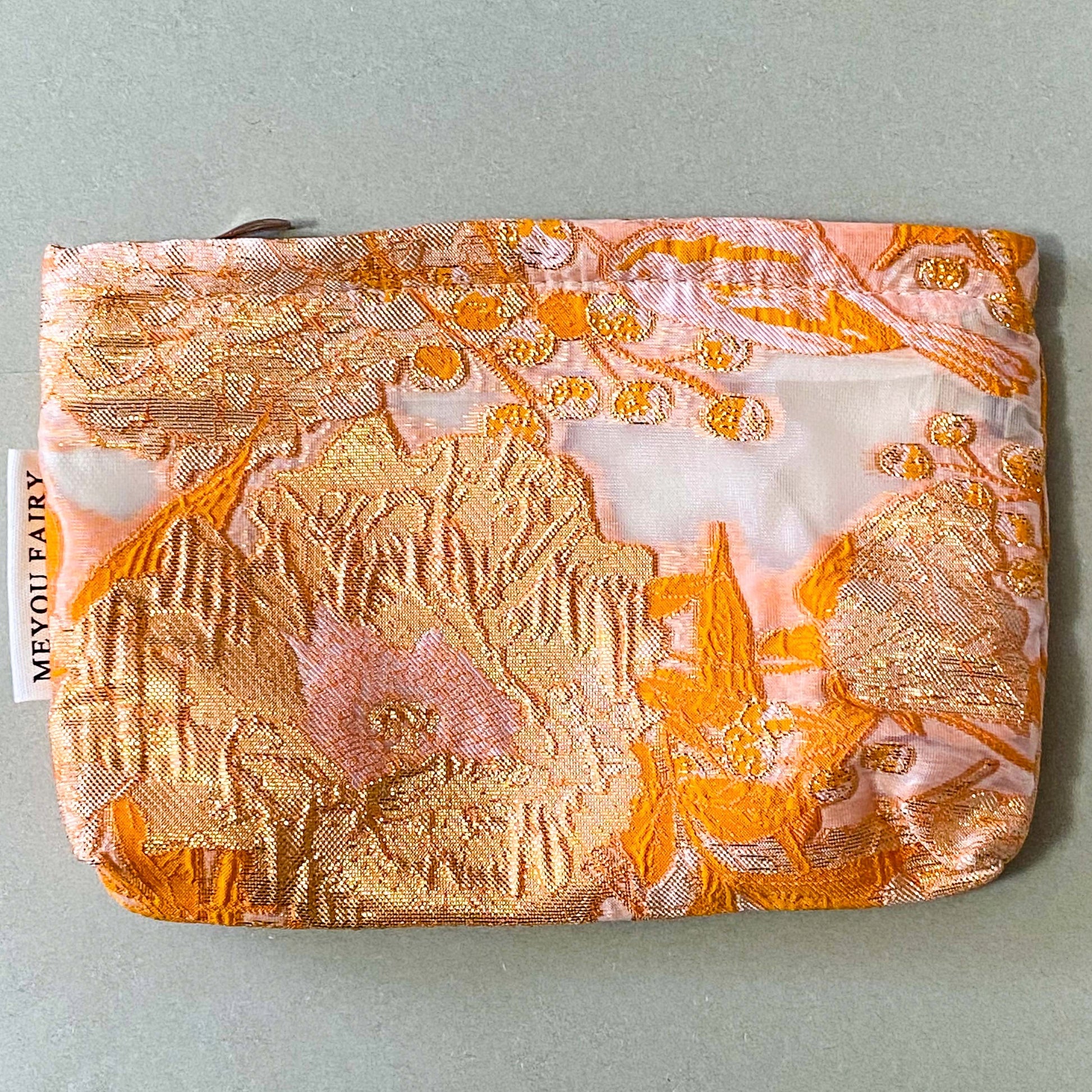 peaches and cream warm orange and gold metallic thread woven tapestry pouch for make up and beauty essentials. fully lined in cream with a concealed zip. floral pattern small fabric cosmetic bag. uk letterbox gifts.