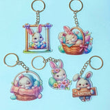 Set of five cute easter bunny acrylic keychains on a light blue background