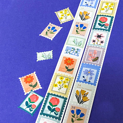 Colourful floral postage stamp stickers on a blue background