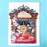 alice in wonderland themed pop up 3d greeting card with tea party scene, white rabbit, mushroom, playing cards and layered theatrical paper design.