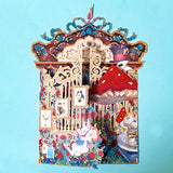 alice in wonderland themed pop up 3d greeting card with tea party scene, white rabbit, mushroom, playing cards and layered theatrical paper design.