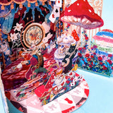 alice in wonderland themed pop up 3d greeting card with tea party scene, white rabbit, mushroom, playing cards and layered theatrical paper design.