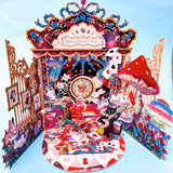 alice in wonderland themed pop up 3d greeting card with tea party scene, white rabbit, mushroom, playing cards and layered theatrical paper design.