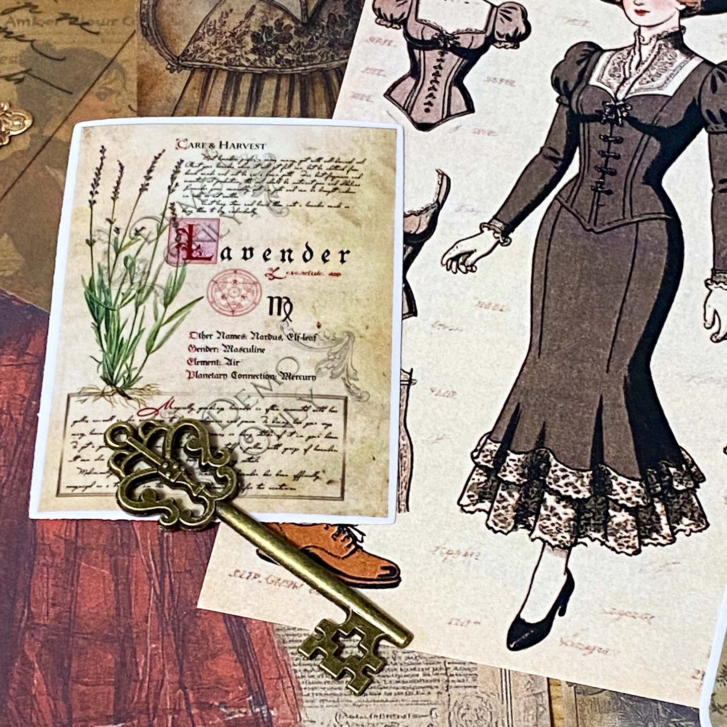 vintage scrapbooking ephemera bundle with victorian portrait stickers, antique papers, vellum sheets, mini envelopes and ornate key on neutral background
