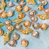 sea shell seashell seashells shells charm charms metal gold silver bright light warm yellow pink pearly small pendant pendants jewellery making supplies craft crafts shop store uk kawaii cute ocean spiral oyster