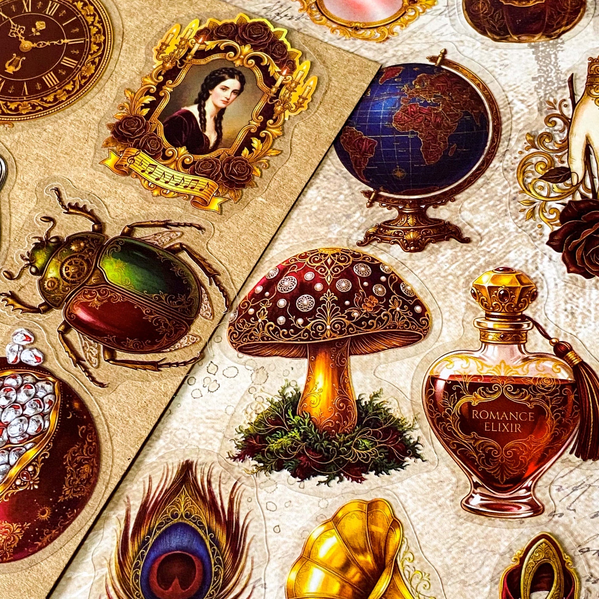 pack of 50 victorian inspired clear PET ephemera stickers featuring antique books, clocks, perfume bottles, roses, swans, butterflies, crowns, handwritten letters and curiosity cabinet treasures in rich dark burgundy, gold, green and midnight blue tones. Uk stationery shop.